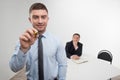 Young businessman holds marker writing, drawing Royalty Free Stock Photo