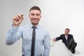 Young businessman holds marker writing, drawing Royalty Free Stock Photo