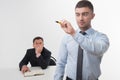 Young businessman holds marker writing, drawing Royalty Free Stock Photo