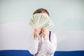 Young businessman holds money in his hands, american hundred dollars cash. American one hundred dollars in cash Royalty Free Stock Photo