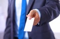 Young businessman holds out his hand with a business card for love Royalty Free Stock Photo