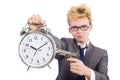 Young businessman holidng gun and alarm clock