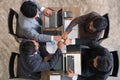 young businessman joining hand together, business team giving fist bump - unity, harmony, teamwork, partnership, collaboration, c Royalty Free Stock Photo