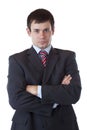 Young businessman looks serious at camera Royalty Free Stock Photo