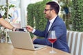 Businessman making contactless card payment in a cafe Royalty Free Stock Photo