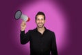 Young businessman with a Megaphone proclaiming something Royalty Free Stock Photo