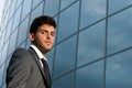 Young businessman on modern building background Royalty Free Stock Photo