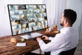 Businessman Monitoring CCTV Camera Footage On Computer Royalty Free Stock Photo