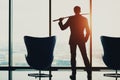 Young businessman in office holding katana Royalty Free Stock Photo