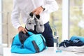 Young businessman packing sports stuff for training Royalty Free Stock Photo