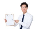 Young businessman pen point to clipboard Royalty Free Stock Photo