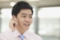 Young Businessman in pink button down shirt on the phone, Beijing, China