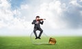 Young businessman plays the violin Royalty Free Stock Photo