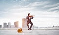 Young businessman plays the violin Royalty Free Stock Photo