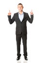 Young businessman pointing upwards Royalty Free Stock Photo