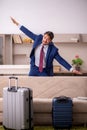 Young businessman preparing for trip at home Royalty Free Stock Photo