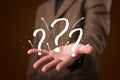 Young businessman presenting hand drawn question marks Royalty Free Stock Photo