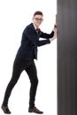 Young Businessman pushing the edge of a blank gray Royalty Free Stock Photo