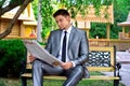 Young businessman reading a newspaper Royalty Free Stock Photo