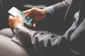 Young businessman in rear of the car. Royalty Free Stock Photo