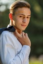 Young businessman relaxes in park