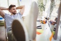 Young businessman relaxing in creative office Royalty Free Stock Photo