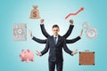 A young businessman resembling Shiva due to four extra arms, juggling with different business-related objects such as Royalty Free Stock Photo