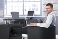 Young businessman resting in armchair with laptop Royalty Free Stock Photo