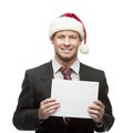 Young businessman in santa hat holding sign Royalty Free Stock Photo