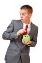 Young businessman saving money Royalty Free Stock Photo