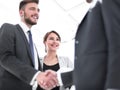 Young businessman shaking hands with his business partner Royalty Free Stock Photo