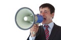 Young businessman shouts loudly into megaphone Royalty Free Stock Photo