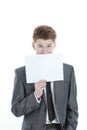 Young businessman showing a blank sheet.isolated on a white Royalty Free Stock Photo