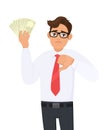 Young businessman showing cash, money and making thumb down gesture sign with hand fingers. Person holding currency notes. Royalty Free Stock Photo