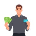 Young businessman showing credit card and cash, money, currency notes in hand. Successful person in vest suit holding debit, ATM Royalty Free Stock Photo