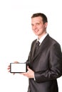 Young businessman showing a tablet pc comuter with blank screen for your sample text