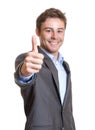 Young businessman showing thumb Royalty Free Stock Photo