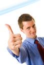 Young businessman showing thumb up. Sign Royalty Free Stock Photo