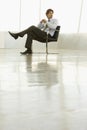 Young Businessman Sitting On Armchair Royalty Free Stock Photo