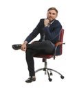 Young businessman sitting in comfortable office chair on white background Royalty Free Stock Photo