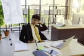 A young businessman is sitting down for a short break