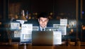 Businessman Sitting At Laptop Networking In Social Media In Office