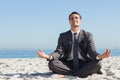 Young businessman sitting with legs crossed relaxing Royalty Free Stock Photo