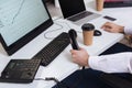 young businessman sitting near computers, smartphone Royalty Free Stock Photo