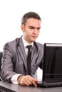 Young businessman sitting at office desk working with laptop Royalty Free Stock Photo