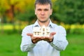 Young businessman with a small house Royalty Free Stock Photo