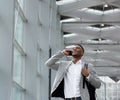 Young businessman smiling and calling by mobile phone Royalty Free Stock Photo