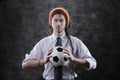 Young businessman with a soccer ball