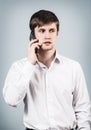 Young businessman speaks on the phone Royalty Free Stock Photo