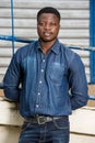 Young businessman standing back to the wall and iron bar Royalty Free Stock Photo